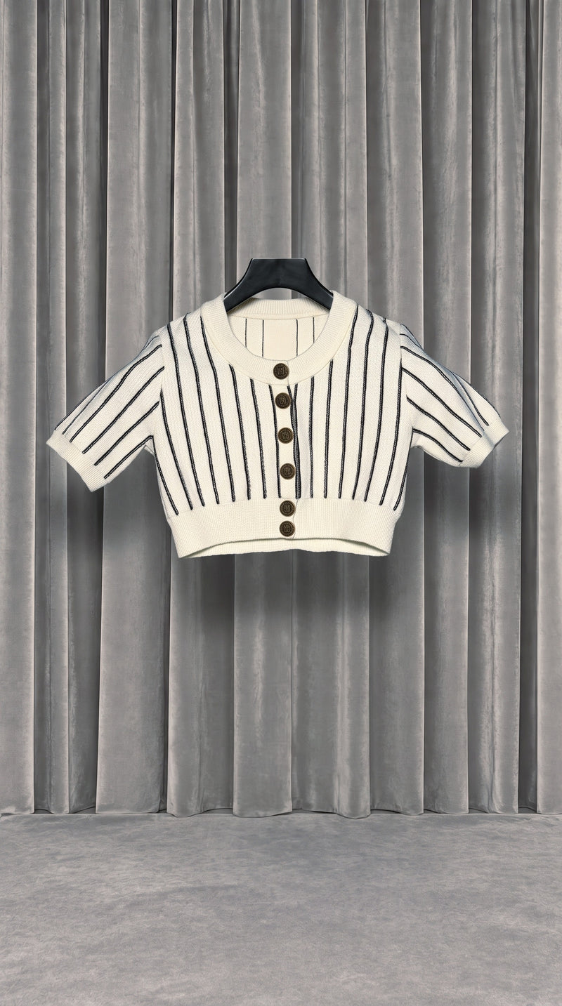 Mausi Cropped Cardigan Women Ivory – product on hanger in front of the grey velvet curtain