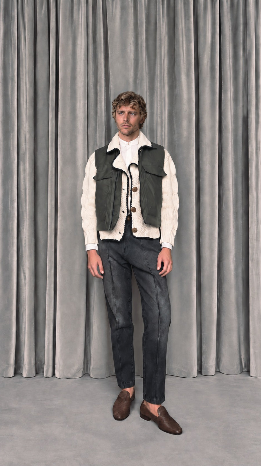 Kill Denim waistcoat over a cream knit, with Kill Denim jeans